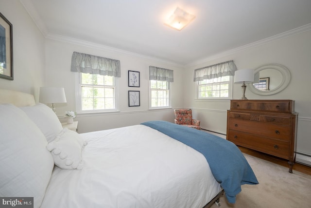 bedroom featuring ornamental molding and baseboard heating
