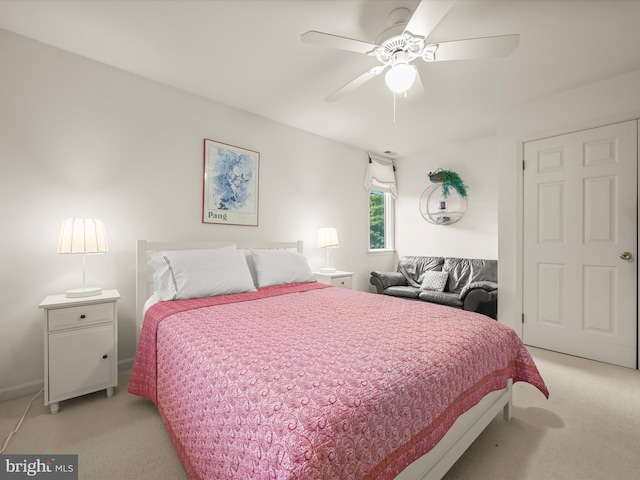 bedroom with light colored carpet and ceiling fan
