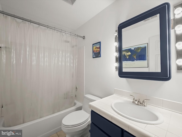 bathroom featuring shower / bath combo with shower curtain, vanity, and toilet