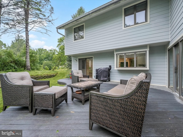 deck with an outdoor hangout area and area for grilling