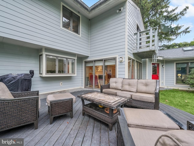 wooden terrace featuring an outdoor living space