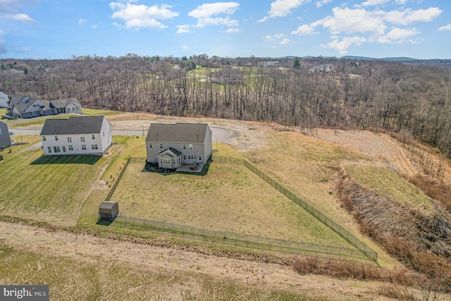 bird's eye view featuring a forest view