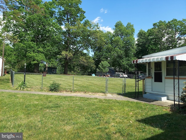 view of yard with fence and a gate