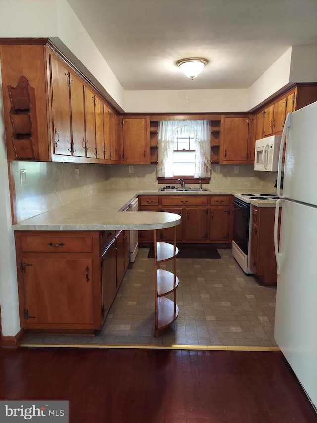kitchen featuring open shelves, brown cabinets, a sink, light countertops, and white appliances