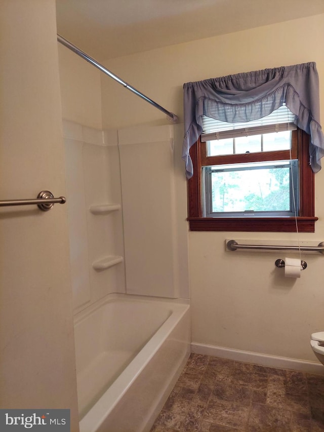 full bathroom with baseboards and toilet