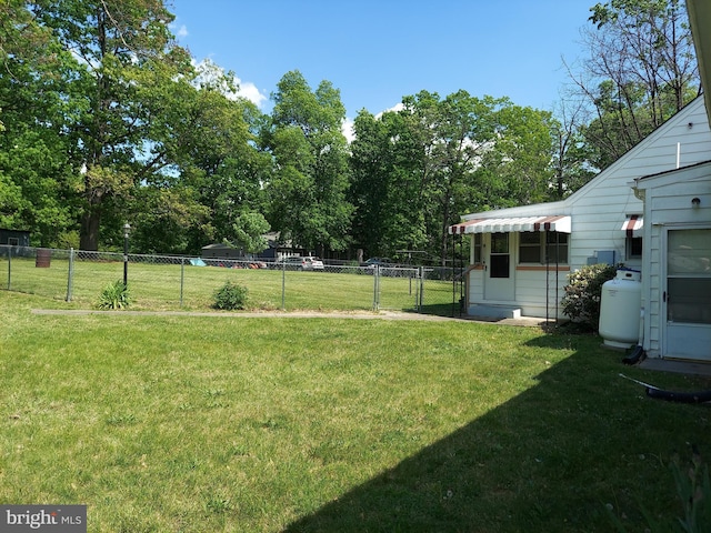 view of yard with fence and a gate