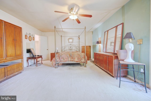 bedroom featuring a ceiling fan and light carpet
