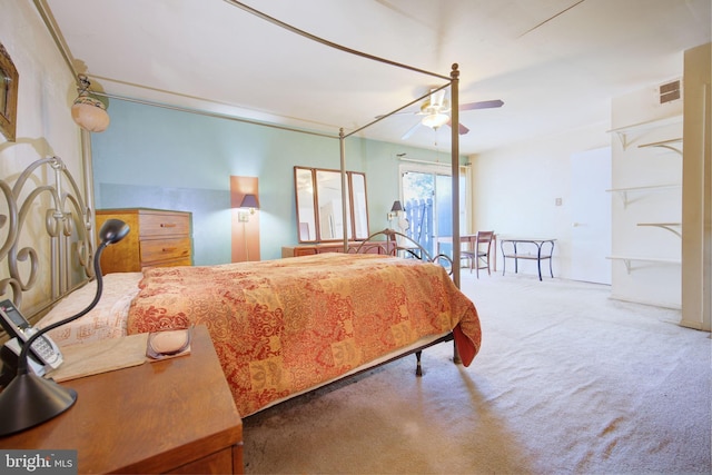 bedroom with visible vents, carpet flooring, and a ceiling fan