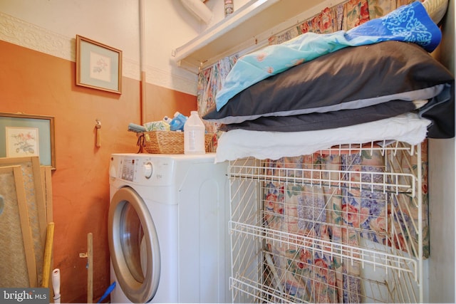 washroom with washer / clothes dryer and laundry area