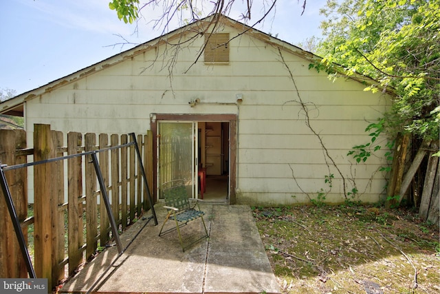 back of property with fence