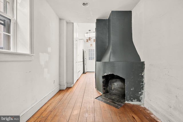 unfurnished living room with hardwood / wood-style floors