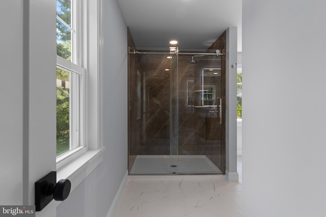 full bathroom with a shower stall, marble finish floor, baseboards, and recessed lighting