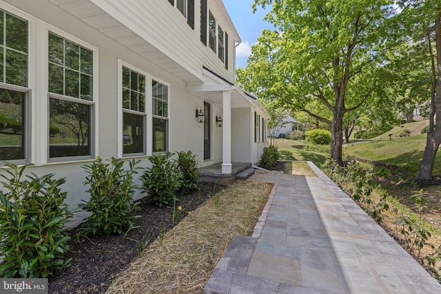 view of side of home with stucco siding