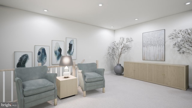 sitting room with carpet floors, baseboards, and recessed lighting