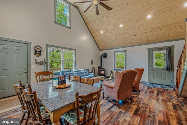 82 Vista River Ln, Paw Paw, WV 25434 - dining area with dark wood-style flooring, a wood stove, high vaulted ceiling, and wood ceiling