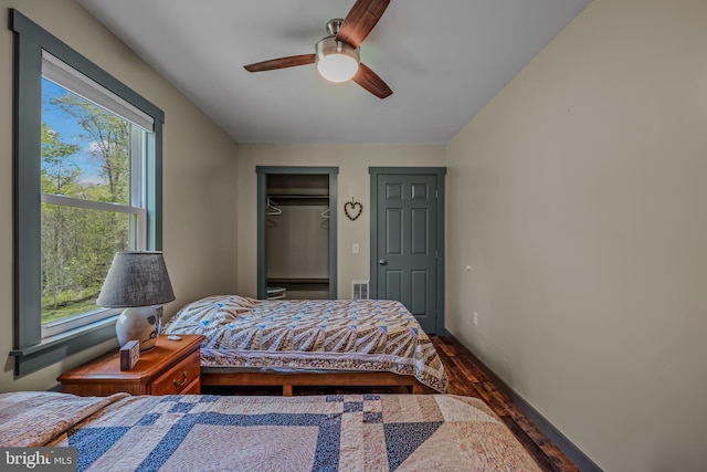82 Vista River Ln, Paw Paw, WV 25434 - bedroom featuring a ceiling fan, multiple windows, visible vents, and wood finished floors