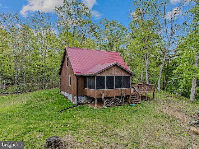 82 Vista River Ln, Paw Paw, WV 25434 - back of house featuring a deck, a yard, metal roof, a sunroom, and a forest view