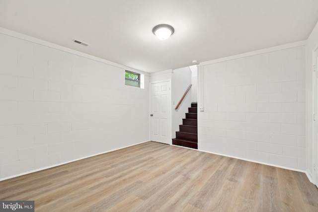 309 Camden Dr, Fredericksburg, VA 22405 - below grade area featuring concrete block wall, wood finished floors, and stairway