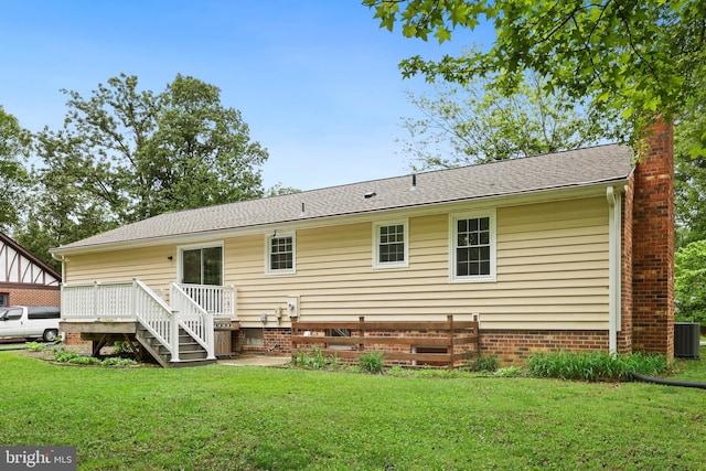 309 Camden Dr, Fredericksburg, VA 22405 - back of house featuring a lawn, a wooden deck, a chimney, and central AC