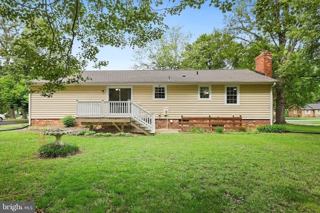 309 Camden Dr, Fredericksburg, VA 22405 - back of property with a wooden deck, a lawn, and a chimney