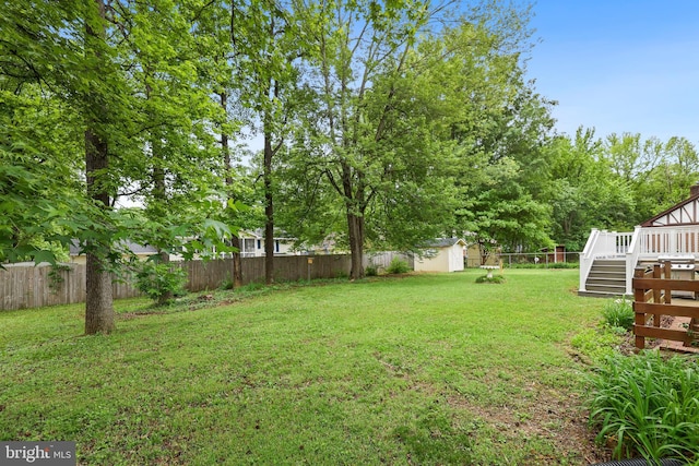 309 Camden Dr, Fredericksburg, VA 22405 - view of yard with a storage unit, a deck, and an outbuilding