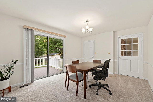 309 Camden Dr, Fredericksburg, VA 22405 - carpeted dining room with a chandelier and baseboards