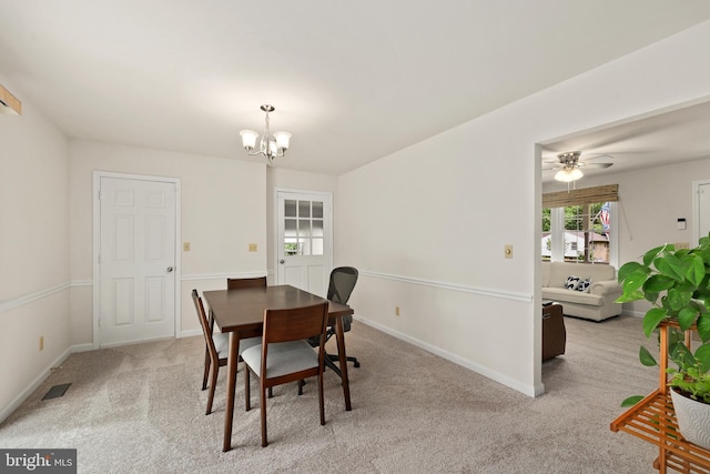 309 Camden Dr, Fredericksburg, VA 22405 - dining room with a chandelier, light colored carpet, baseboards, and ceiling fan