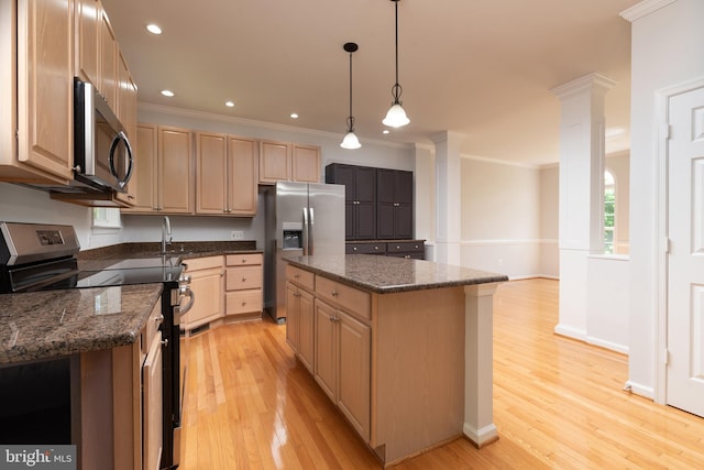 kitchen featuring appliances with stainless steel finishes, light brown cabinetry, light wood-type flooring, crown molding, and a kitchen island
