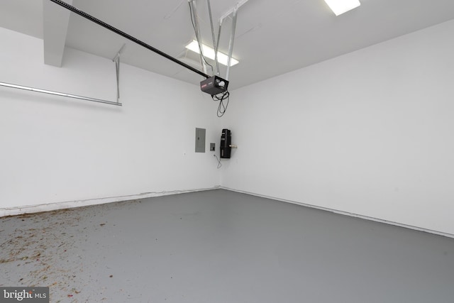 garage with electric panel and a garage door opener