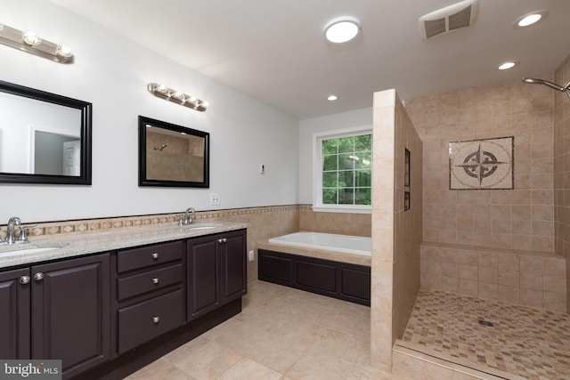 full bathroom with tile patterned floors, a tile shower, double vanity, a bath, and recessed lighting