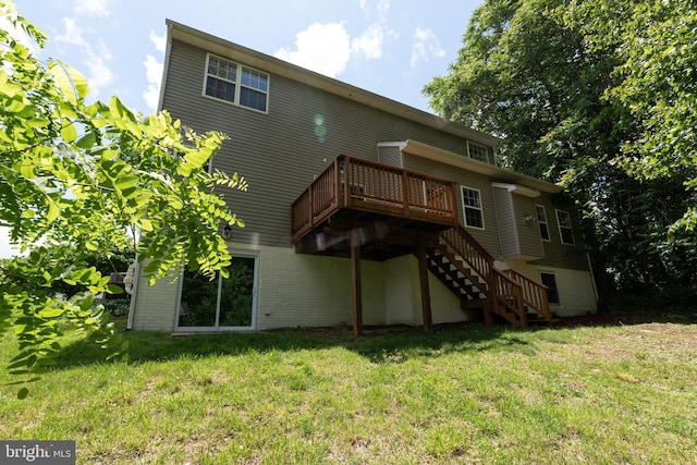 rear view of property featuring a wooden deck, stairs, and a yard