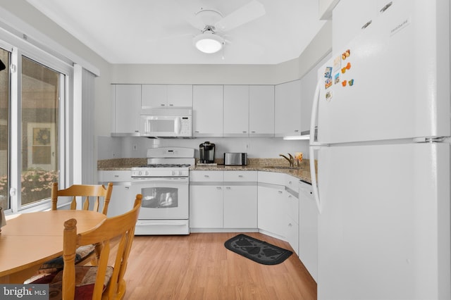 5025A S Convent Ln Unit 142, Philadelphia, PA 19114 - kitchen with white appliances, white cabinets, a sink, light wood-style flooring, and ceiling fan