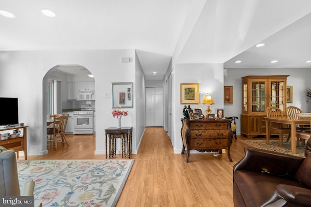 5025A S Convent Ln Unit 142, Philadelphia, PA 19114 - living area with light wood-style flooring, recessed lighting, arched walkways, and baseboards