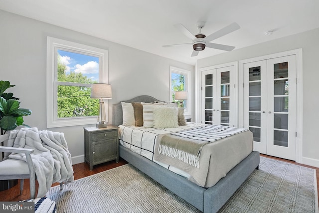 bedroom with french doors, dark wood finished floors, baseboards, and access to outside