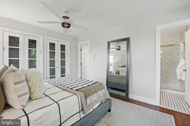 bedroom featuring baseboards, multiple windows, french doors, and wood finished floors
