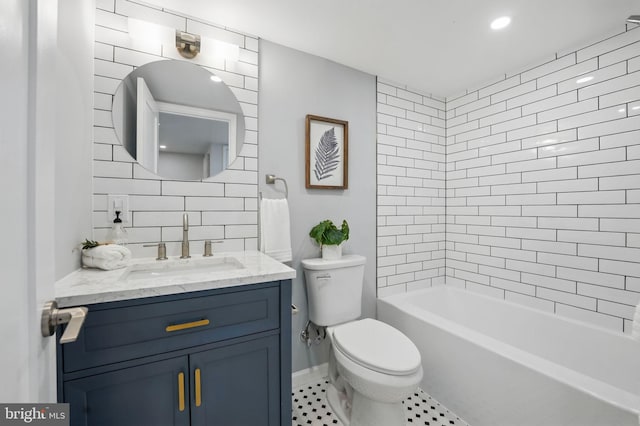 bathroom featuring toilet, tile patterned flooring, and vanity