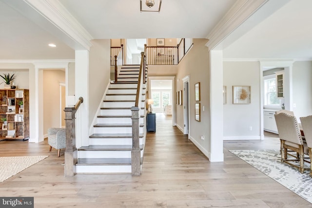 3919 Pineland St, Fairfax, VA 22031 - foyer with ornamental molding, light wood finished floors, a wealth of natural light, and stairway
