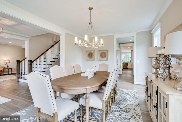 3919 Pineland St, Fairfax, VA 22031 - dining room with crown molding, baseboards, an inviting chandelier, stairs, and light wood-style flooring