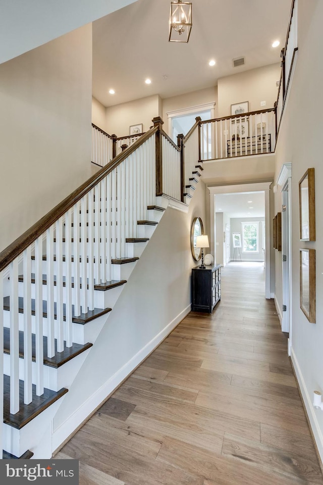 3919 Pineland St, Fairfax, VA 22031 - staircase with a towering ceiling, visible vents, wood finished floors, baseboards, and recessed lighting