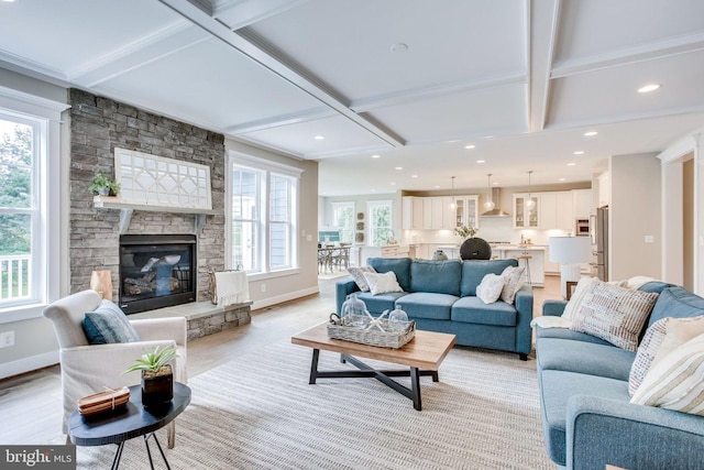 3919 Pineland St, Fairfax, VA 22031 - living area with beam ceiling, light wood finished floors, a stone fireplace, baseboards, and coffered ceiling