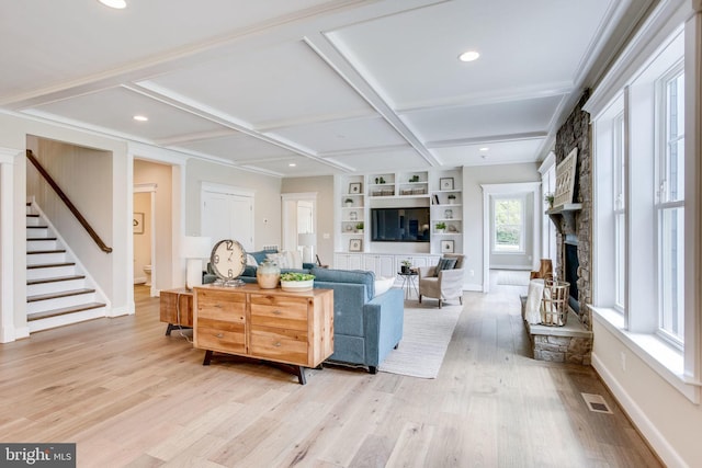 3919 Pineland St, Fairfax, VA 22031 - living room featuring visible vents, stairs, a stone fireplace, coffered ceiling, and light wood-style flooring