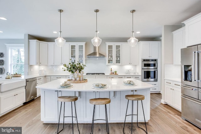 3919 Pineland St, Fairfax, VA 22031 - kitchen with a center island, white cabinetry, tasteful backsplash, and stainless steel appliances
