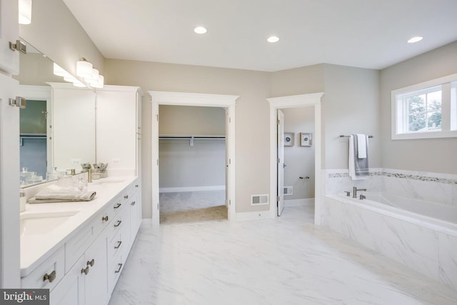3919 Pineland St, Fairfax, VA 22031 - full bathroom featuring double vanity, a bath, visible vents, a sink, and marble finish floor