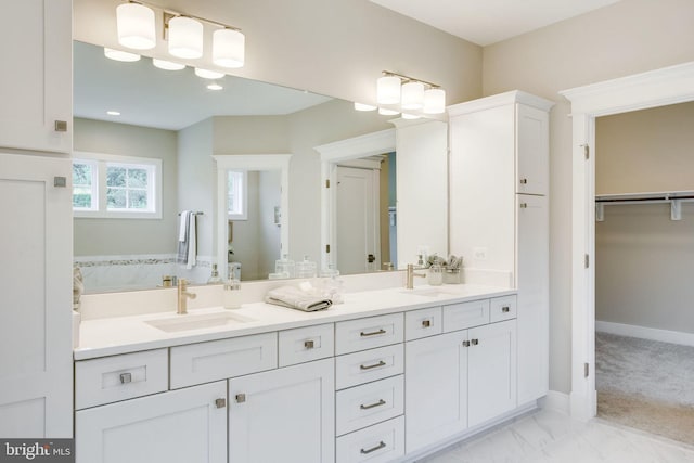3919 Pineland St, Fairfax, VA 22031 - bathroom with double vanity, a spacious closet, a sink, and marble finish floor