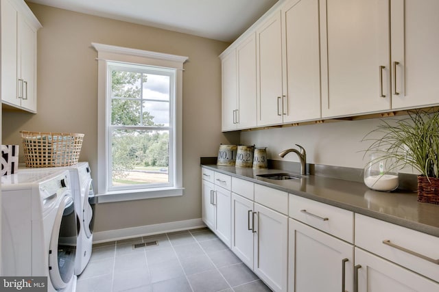 3919 Pineland St, Fairfax, VA 22031 - washroom with visible vents, cabinet space, a sink, baseboards, and washer and dryer