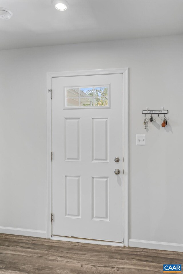 doorway to outside with baseboards, recessed lighting, and wood finished floors