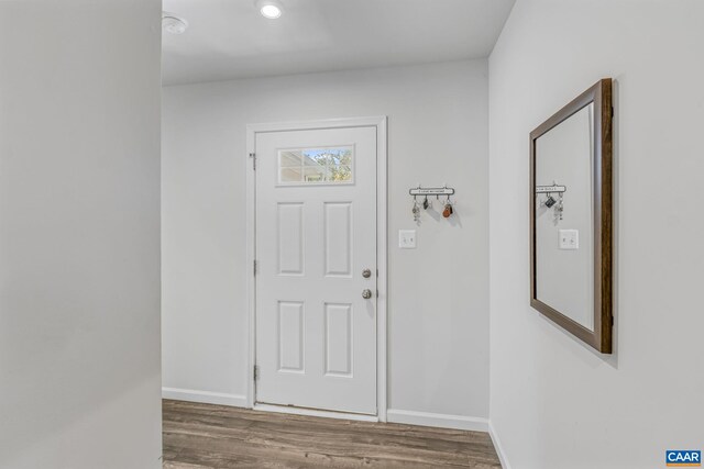 entrance foyer with baseboards, recessed lighting, and wood finished floors