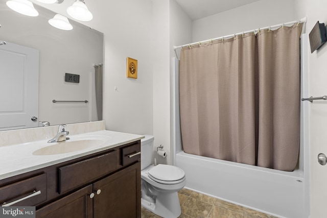 full bath featuring vanity, toilet, and shower / tub combo