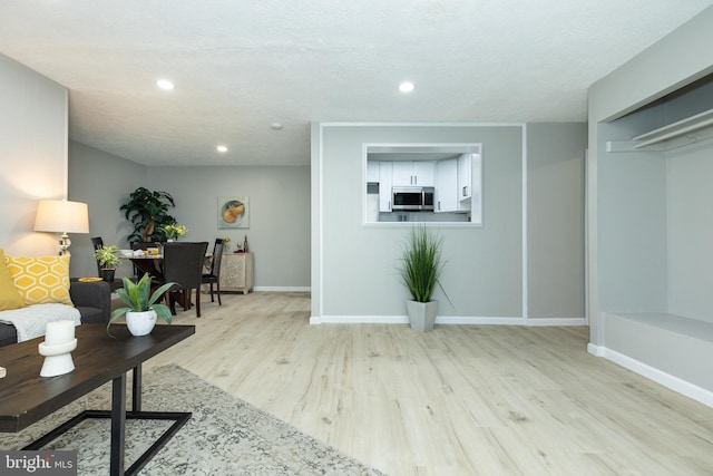 160 Talbott St Unit T5, Rockville, MD 20852 - living room with wood finished floors, baseboards, and recessed lighting