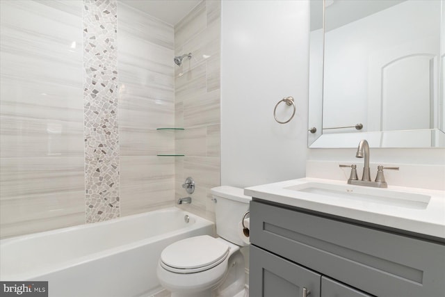 bathroom featuring vanity, bathtub / shower combination, and toilet